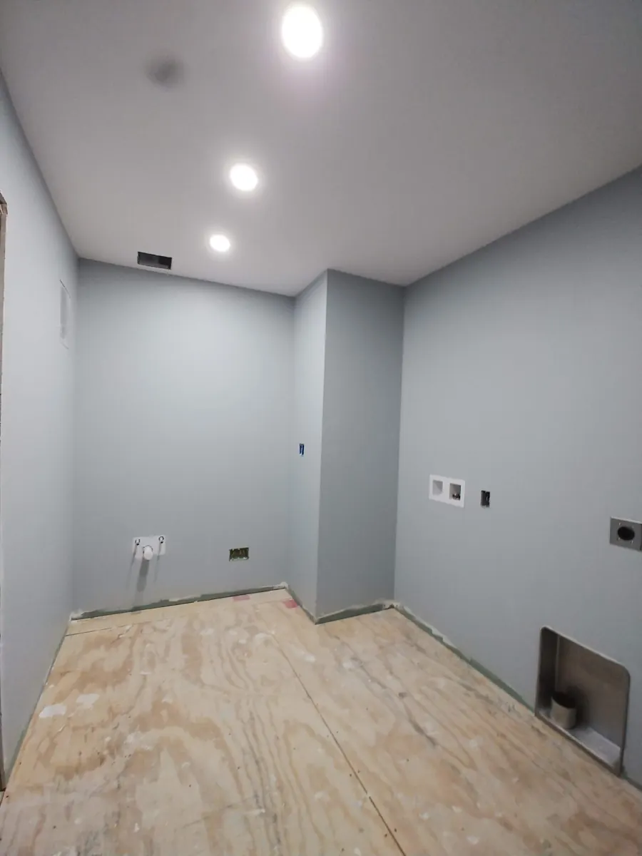 Laundry room with fresh paint ready for flooring