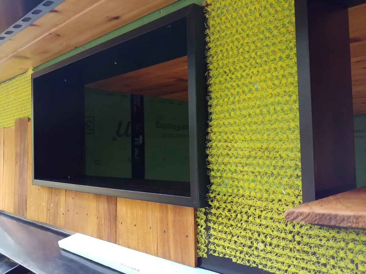Exterior wall with drainage mat and new window ready for siding